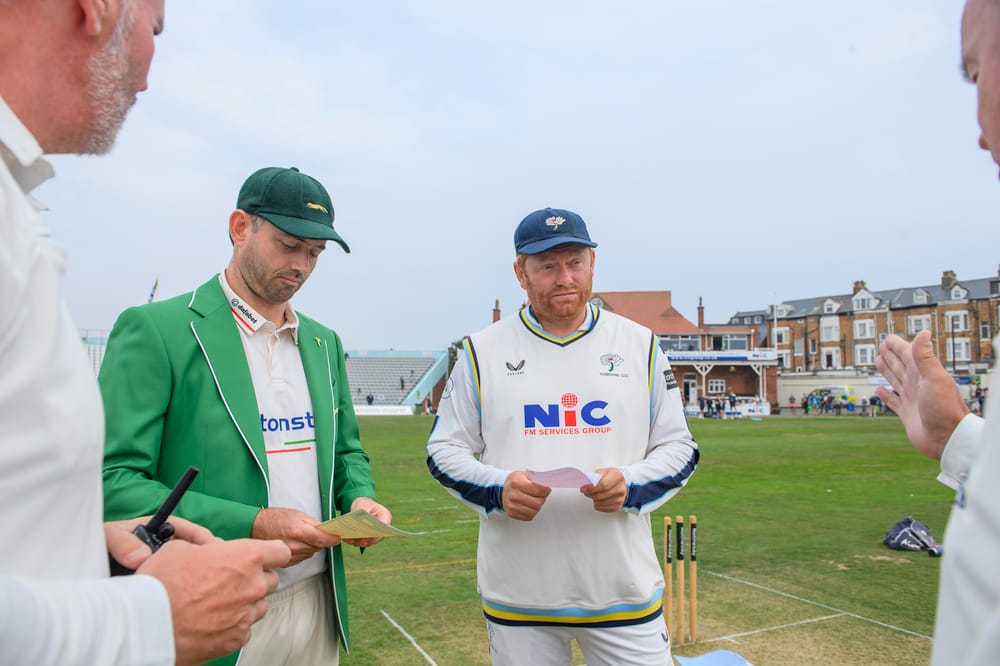 Picture by Allan McKenzie/SWpix.com - 27/08/2026 - Cricket - Rothesay County Championship - Yorkshire County Cricket Club v Leicestershire County Cricket Club - North Marine Road, Scarborough, England - Leicestershire and Yorkshire captain's Ian Holland and Jonny Bairstow at the coin toss.