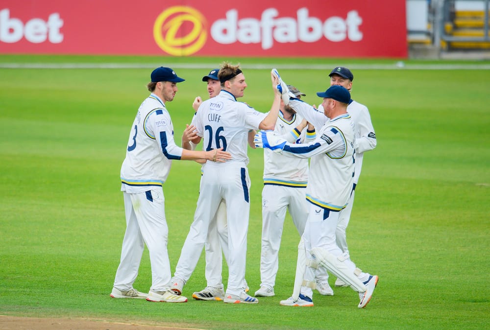Picture by Allan McKenzie/SWpix.com - 18/09/2026 - Cricket - Rothesay County Championship - Yorkshire County Cricket Club v Somerset County Cricket Club - Headingley Cricket Ground, Leeds, England - Yorkshire's Ben Cliff is congratulated on dismissing Somerset's Lewis Gregory.