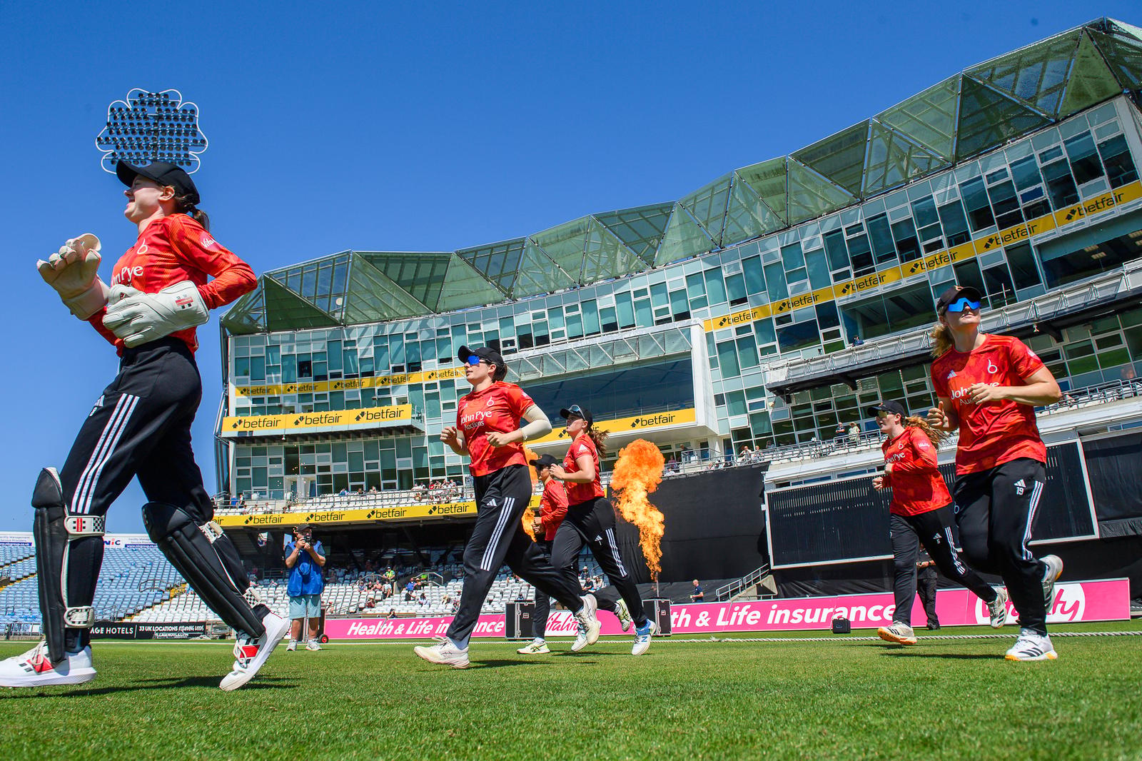 Picture by Allan McKenzie/SWpix.com - 12/07/2026 - Cricket - Vitality Blast Women - Yorkshire Women v The Blaze - Headingley Cricket Ground, Leeds, England - The Blaze come out to field against Yorkshire.